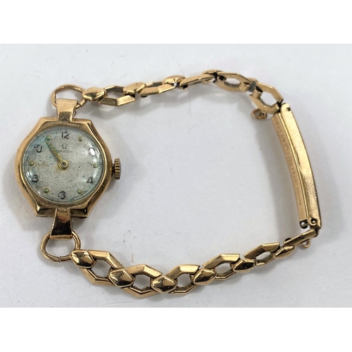 755 - A ladies 9 carat hallmarked gold wristwatch on 9 carat expanding strap, net weight 11.4 gm