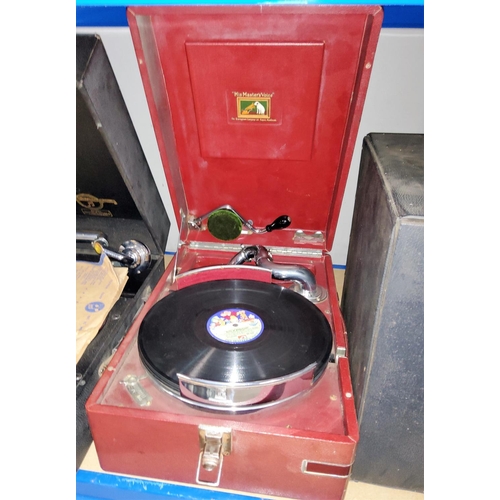 179 - An HMV portable record player and a selection of vintage records