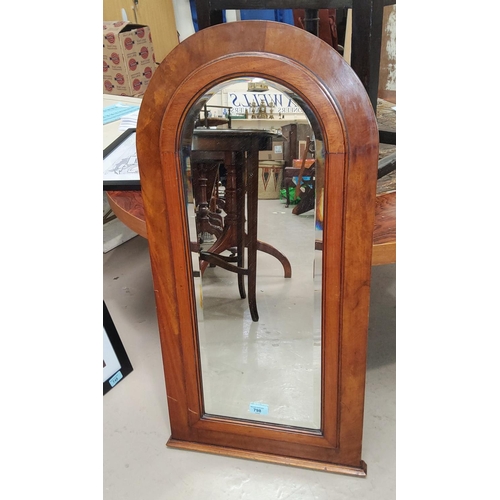 798 - A mahogany arch framed bevel edge glass mirror ht.84cm