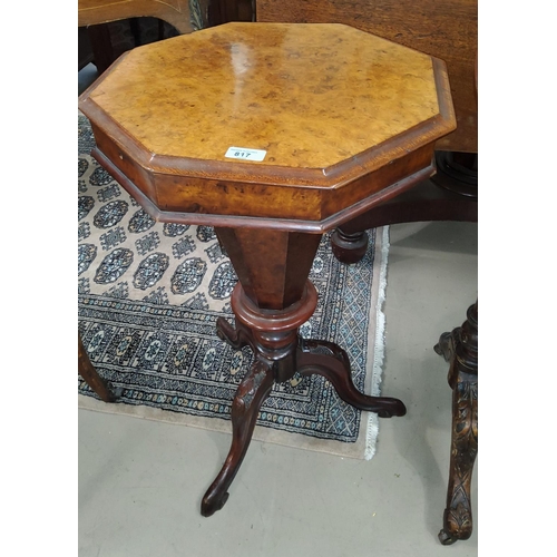 817 - A Victorian burr walnut work table, the octagonal hinged top revealing fitted tapering well, on turn... 