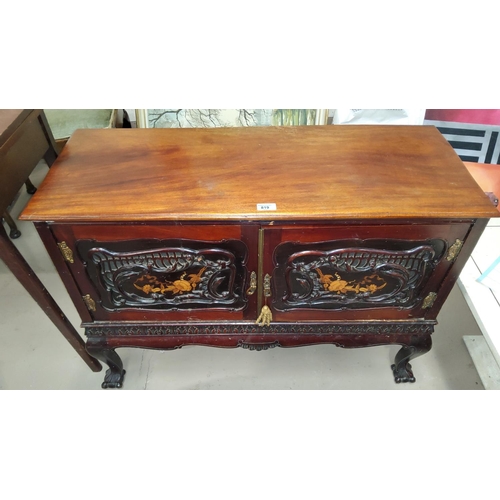 819 - An Edwardian mahogany side cabinet enclosed by 2 doors, with extensive relief carved and floral marq... 