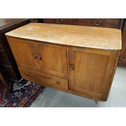 913 - A 1960's Ercol elm and beech sideboard of double cupboard, side cupboard and drawer