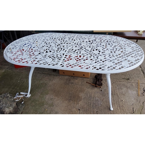 795 - A large Victorian style oval cast metal garden table length 185cm