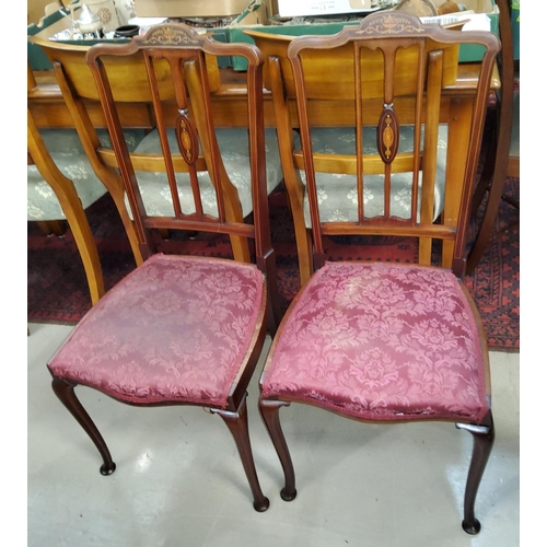 822 - An Edwardian set of 4 inlaid mahogany salon chairs in the Sheraton style, overstuffed seats in wine ... 
