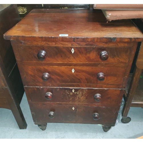 823 - A Georgian figured mahogany commode with hinged top and front panel, 4 false drawer fascias with tur... 