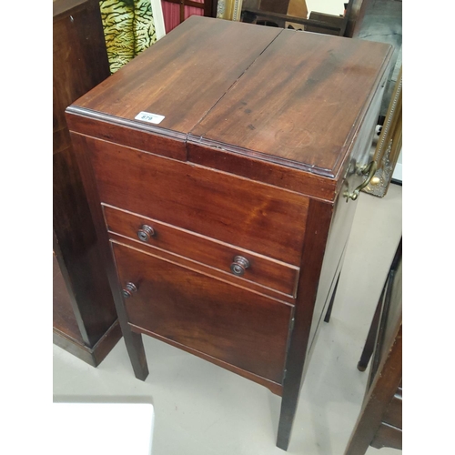 879 - A Georgian mahogany bedside cabinet with double hinged top drawer and cupboard