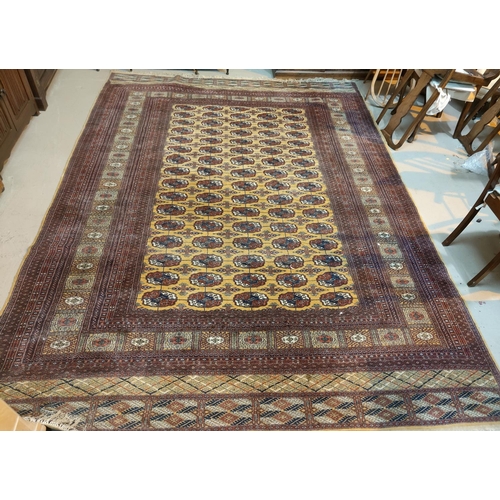 893 - A modern hand knotted Pakistan Bokhara carpet with fawn ground, 340 x 256 cm