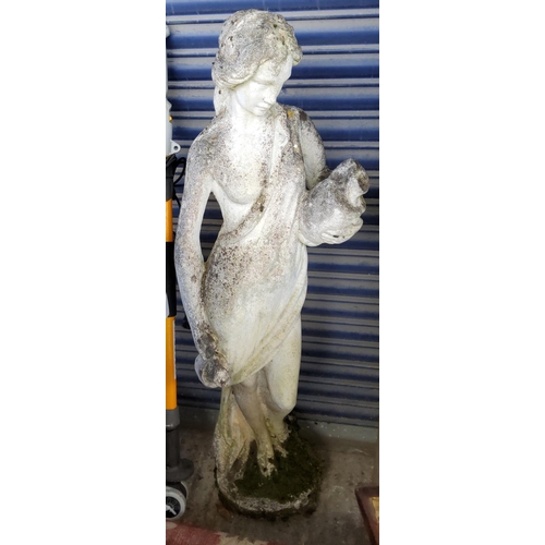 919 - A reconstituted stone garden figure of a female in classical dress, height 130cm