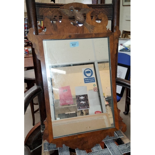 937 - A Chippendale style wall mirror in a walnut fretwork frame, height 66cm.