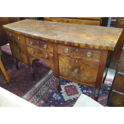 938 - A Georgian mahogany 'D' front sideboard with crossbanded top, 5 drawers and 1 cupboard, on turned an... 