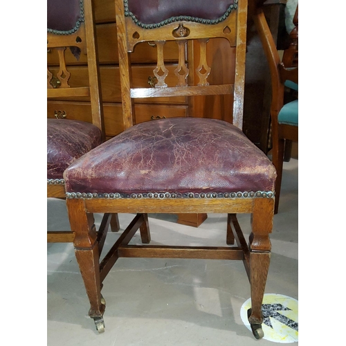 943 - 8 Art Nouveau oak dining chairs (6+2) with red leather inserts, carved decoration, tapering uprights... 