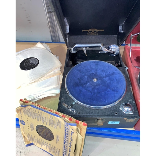 180 - A Columbia portable record player and a selection of vintage records