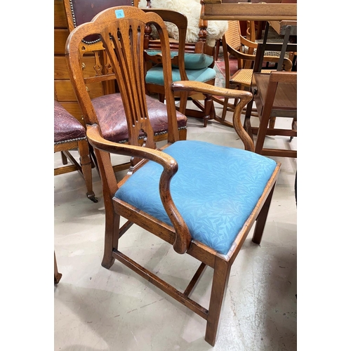 876 - A late 18th/early 19th century 'Country Hepplewhite' armchair on square legs