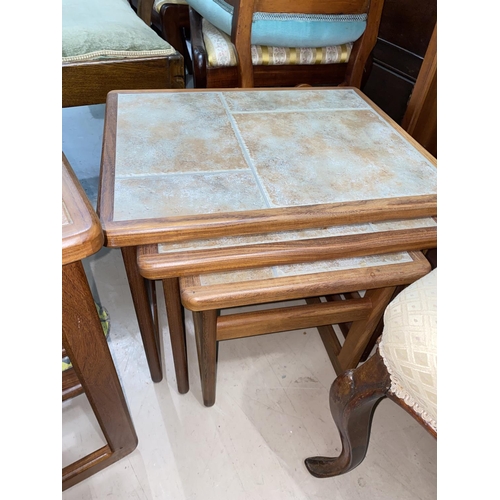 945 - A nest of mid 20th century teak, tile top tables and another tile top table