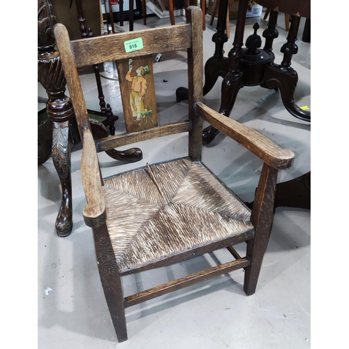 916 - A child's oak rush seat chair with transfer decoration and a stained wood corner armchair