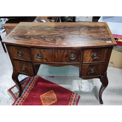 909 - A mahogany dressing table with unusual carved cabriole legs