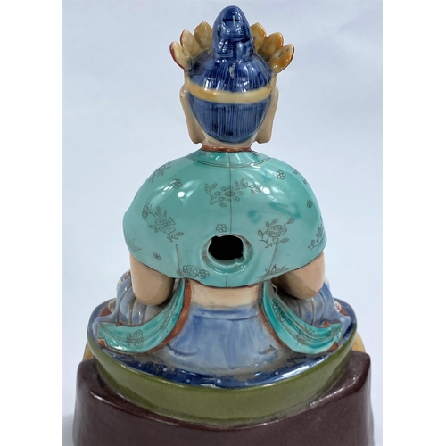 419 - A Chinese ceramic figure of a Buddha in seated lotus position with hole to back possibly for wall ha... 