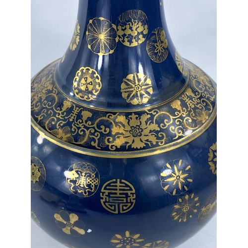 440 - A Chinese blue ground vase with gilt decoration & highlights, with character marks to base, heig... 