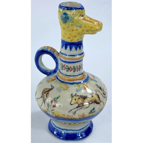 476 - A high fired glazed jug with giraffe head rim