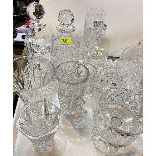 501 - Three crystal decanters; a selection of cut glassware:  jugs; bowls; vases; etc.