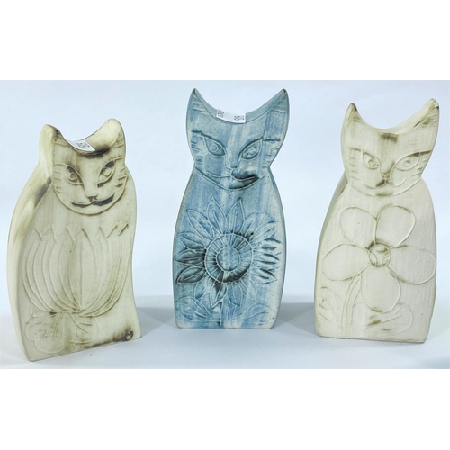 519 - Three cats from Carn Pottery, Cornwall; 2 similar vases, all signed