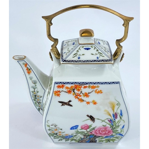 587 - A 20th century Japanese porcelain teapot decorated in polychrome