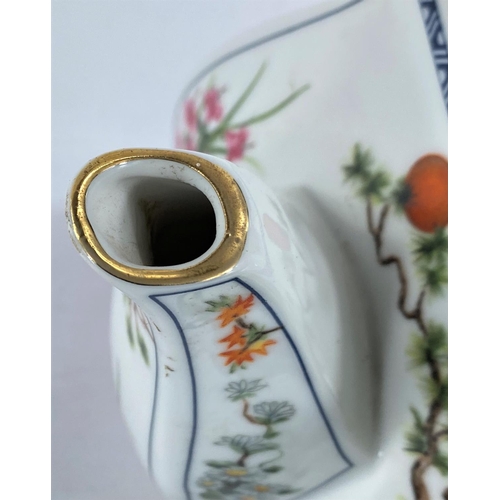 587 - A 20th century Japanese porcelain teapot decorated in polychrome