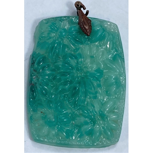 620 - A rectangular turquoise jade coloured pendant in the Chinese manner with relief decoration of flower... 