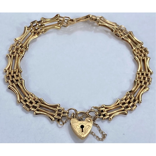 631 - A 9ct gold gate bracelet with heart lock stamped '375', 6gm