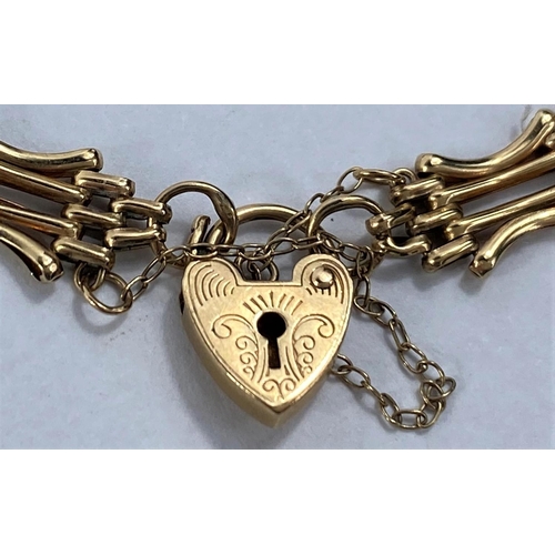 631 - A 9ct gold gate bracelet with heart lock stamped '375', 6gm