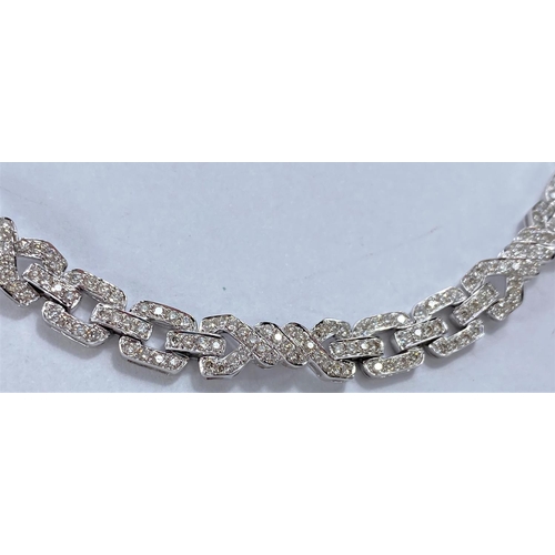 644 - An 18ct hallmarked white gold Art Deco style diamond bracelet , each link encrusted with diamonds, 1... 