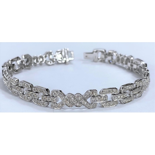 644 - An 18ct hallmarked white gold Art Deco style diamond bracelet , each link encrusted with diamonds, 1... 