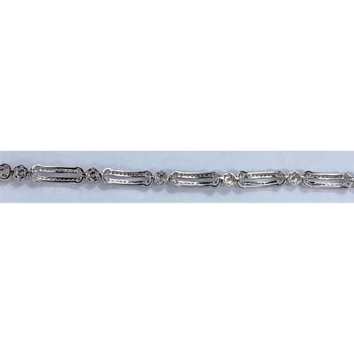 648 - A white gold Art Deco style bracelet set with alternating encrusted elongated and flower head links,... 