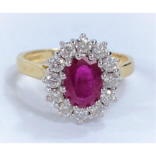 656 - An 18ct hallmarked gold cluster dress ring with central ruby surrounded by 12 diamonds, 5.6gms size ... 