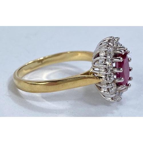 656 - An 18ct hallmarked gold cluster dress ring with central ruby surrounded by 12 diamonds, 5.6gms size ... 