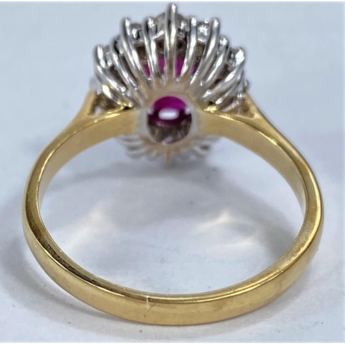 656 - An 18ct hallmarked gold cluster dress ring with central ruby surrounded by 12 diamonds, 5.6gms size ... 