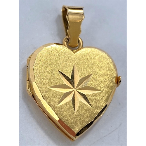 659 - A matt yellow metal heart shaped locket pendant with star motif, loop stamped 