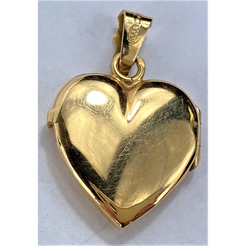 659 - A matt yellow metal heart shaped locket pendant with star motif, loop stamped 