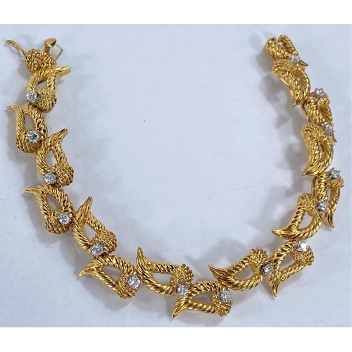 665 - A yellow metal bracelet formed from 15 elongated rounded links each set with a diamond, stamped 'K18... 