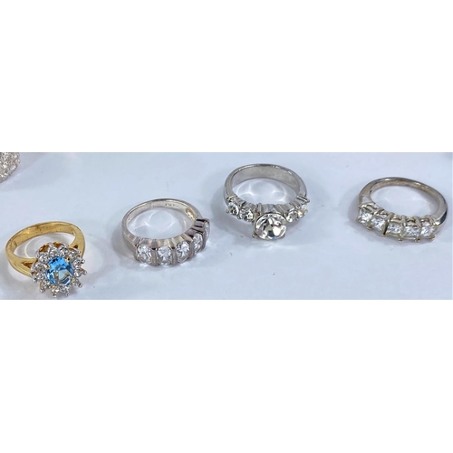 675 - Eleven white metal assorted dress rings set coloured stones, some stamped '925'; etc.