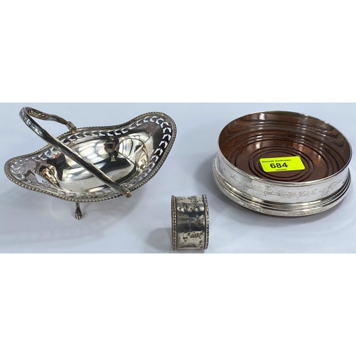 684 - A hallmarked silver coaster, Birmingham; a hallmarked silver napkin ring; a silver plated bonbon dis... 