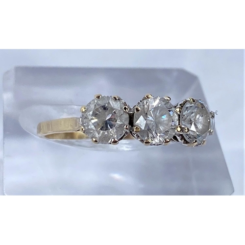 698 - A 14 carat hallmarked gold dress ring set 3 large brilliant cut cubic zirconias, 3 gm size R/S