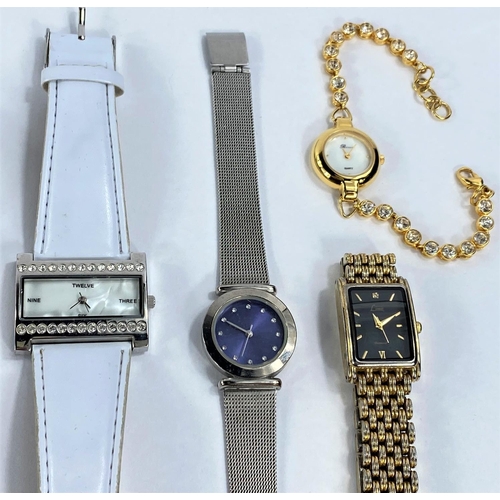 700 - Three modern ladies dress watches; 5 other ladies watches