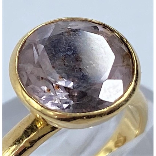 704 - An 18 carat hallmarked gold dress ring set large pale amethyst coloured stone, 5.8 gm size N