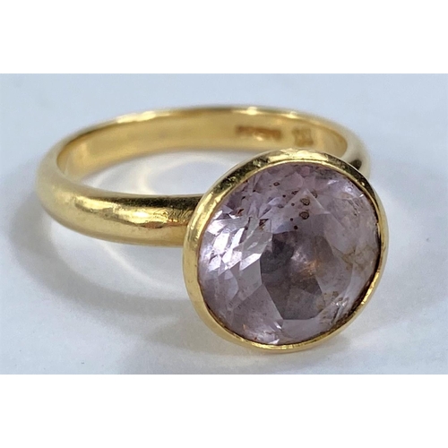 704 - An 18 carat hallmarked gold dress ring set large pale amethyst coloured stone, 5.8 gm size N