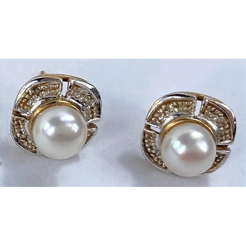 710 - A pair of pearl set earrings, stamped '375'; 2 other pairs of earrings