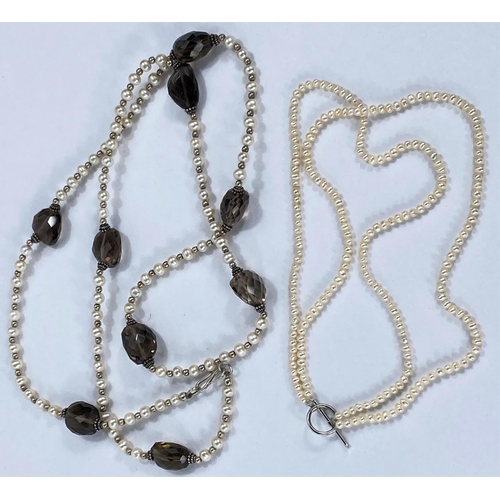 716 - A long necklace formed from cultured pearls and gold coloured beads interspersed with faceted smoky ... 