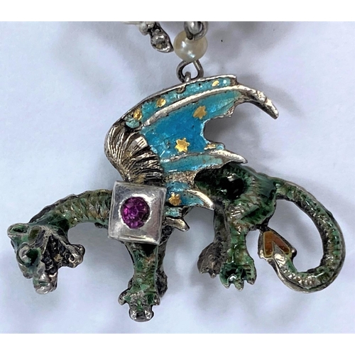 718 - A Prussian enamelled pendant depicting George and the dragon; an Egyptian Pharaoh head pendant and n... 