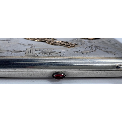 758 - A Russian silver cigarette case, press button set with cabochon garnet, with decorative gold mounts,... 