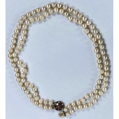 759 - A double string cultured pearl necklace with 9ct gold clasp set with citrines and seed pearls, lengt... 